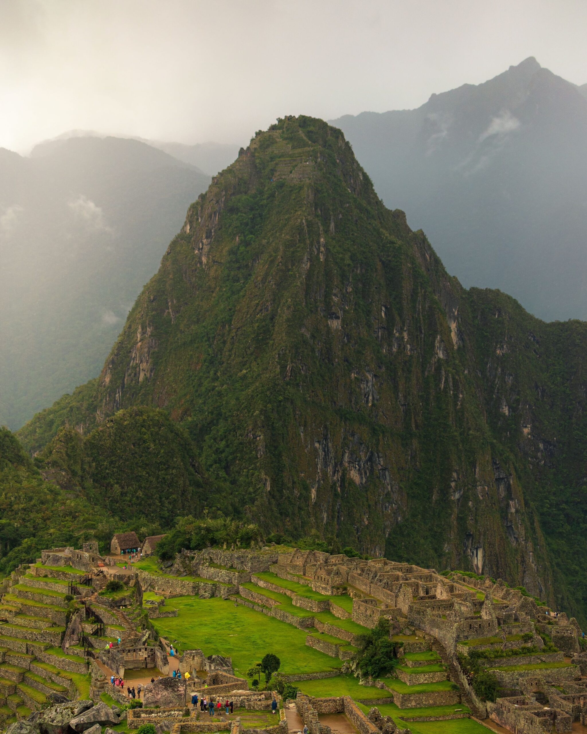Aerial view of the Machu Picchu citadel surrounded by steep green Andes peaks