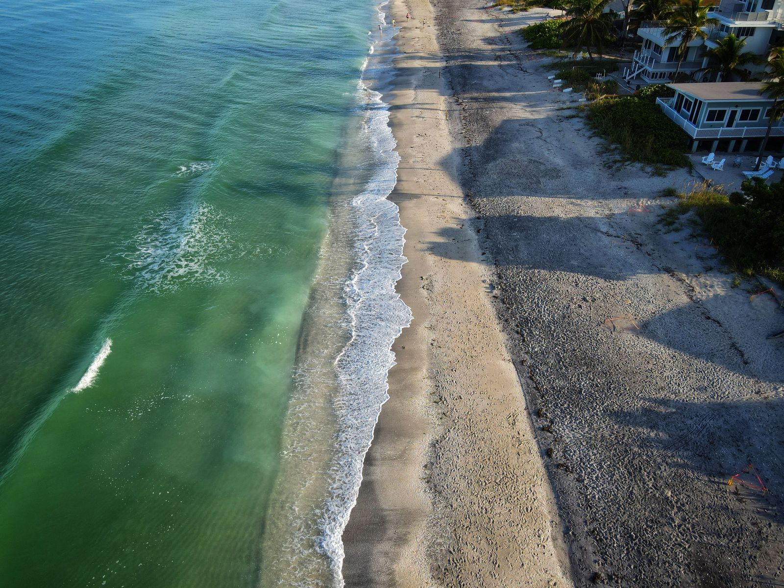 Aerial view of a sandy Florida Keys beach meeting turquoise water