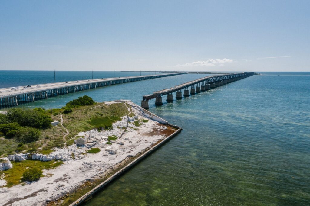 Aerial view of the Seven Mile Bridge crossing clear blue water in the Florida Keys