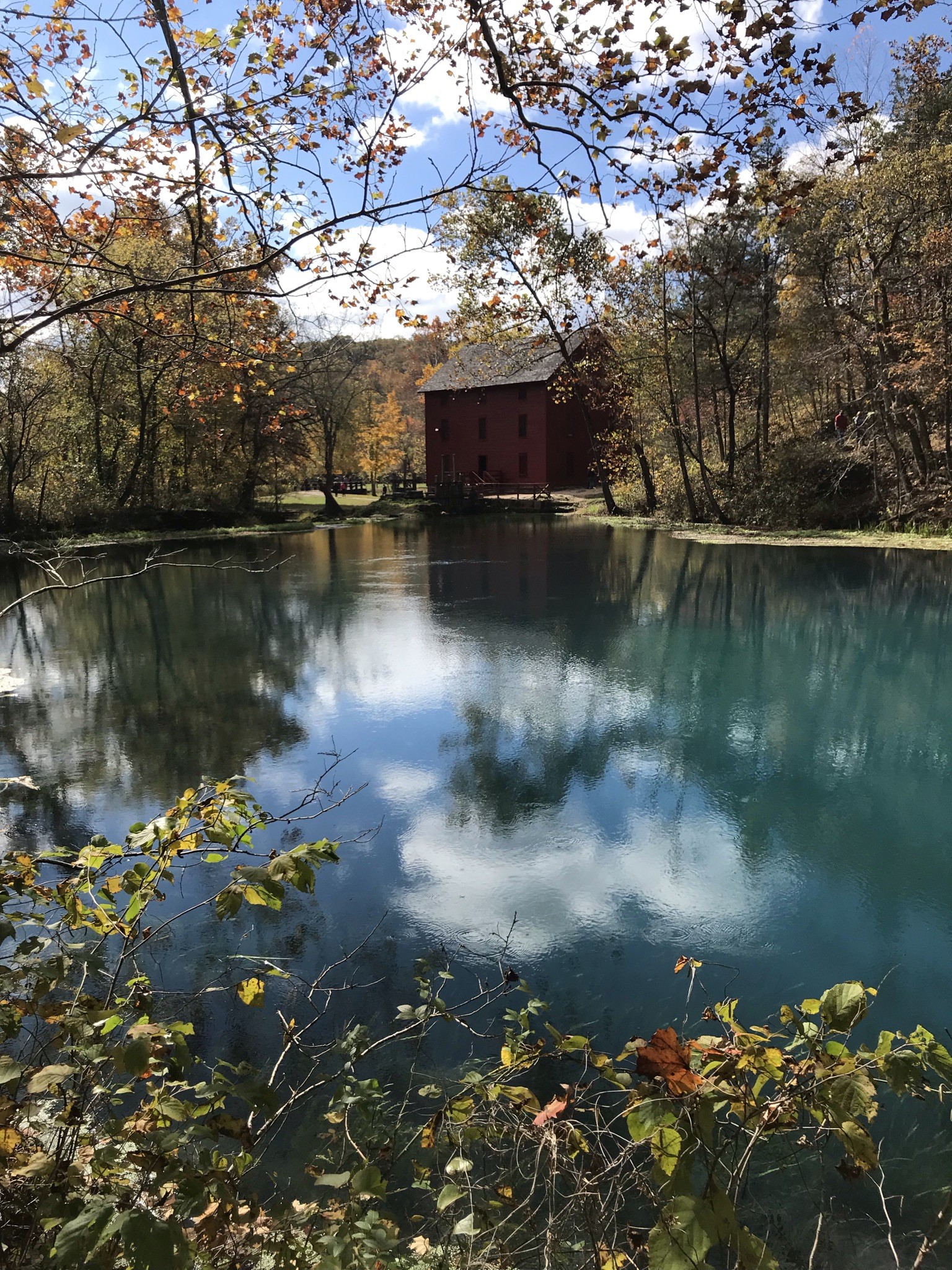Alley Mill and its spring pool in fall foliage near Eminence, Missouri
