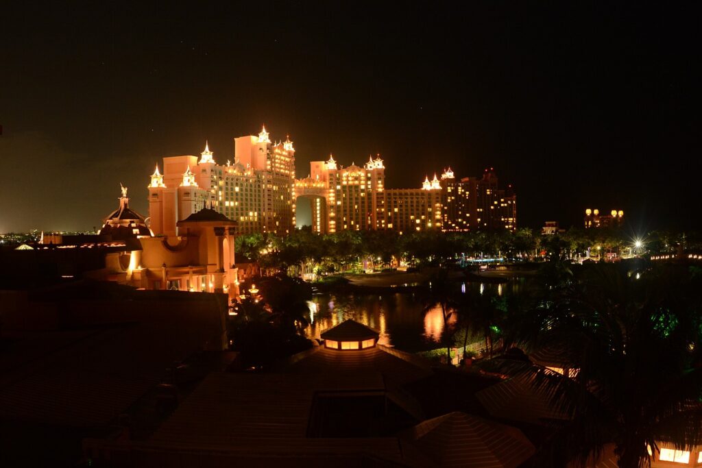 Atlantis Royal Towers resort lit up at night on Paradise Island near Nassau