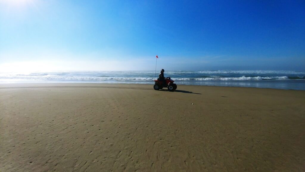ATV with a safety flag on the beach at the Oregon Dunes