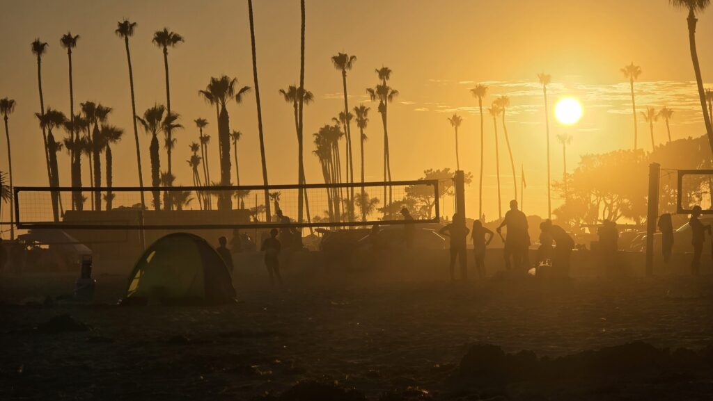 Beach volleyball at sunset under the palms at Corona del Mar