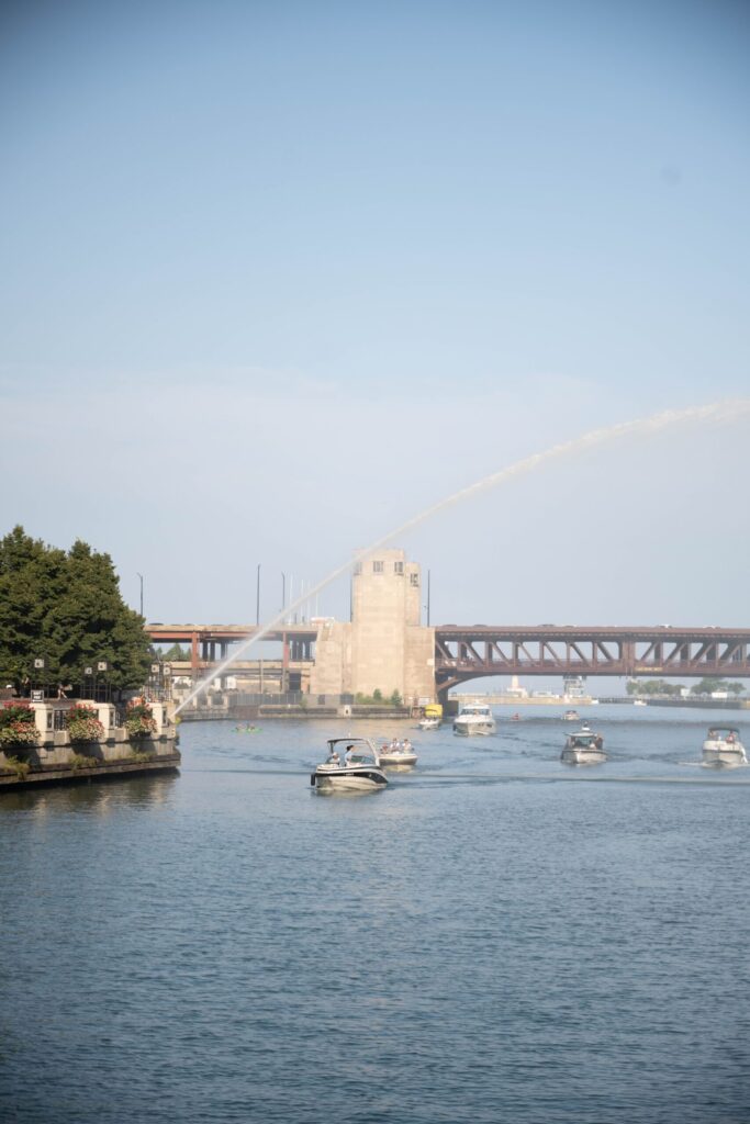 A boat passes beneath a downtown Chicago bridge on the river