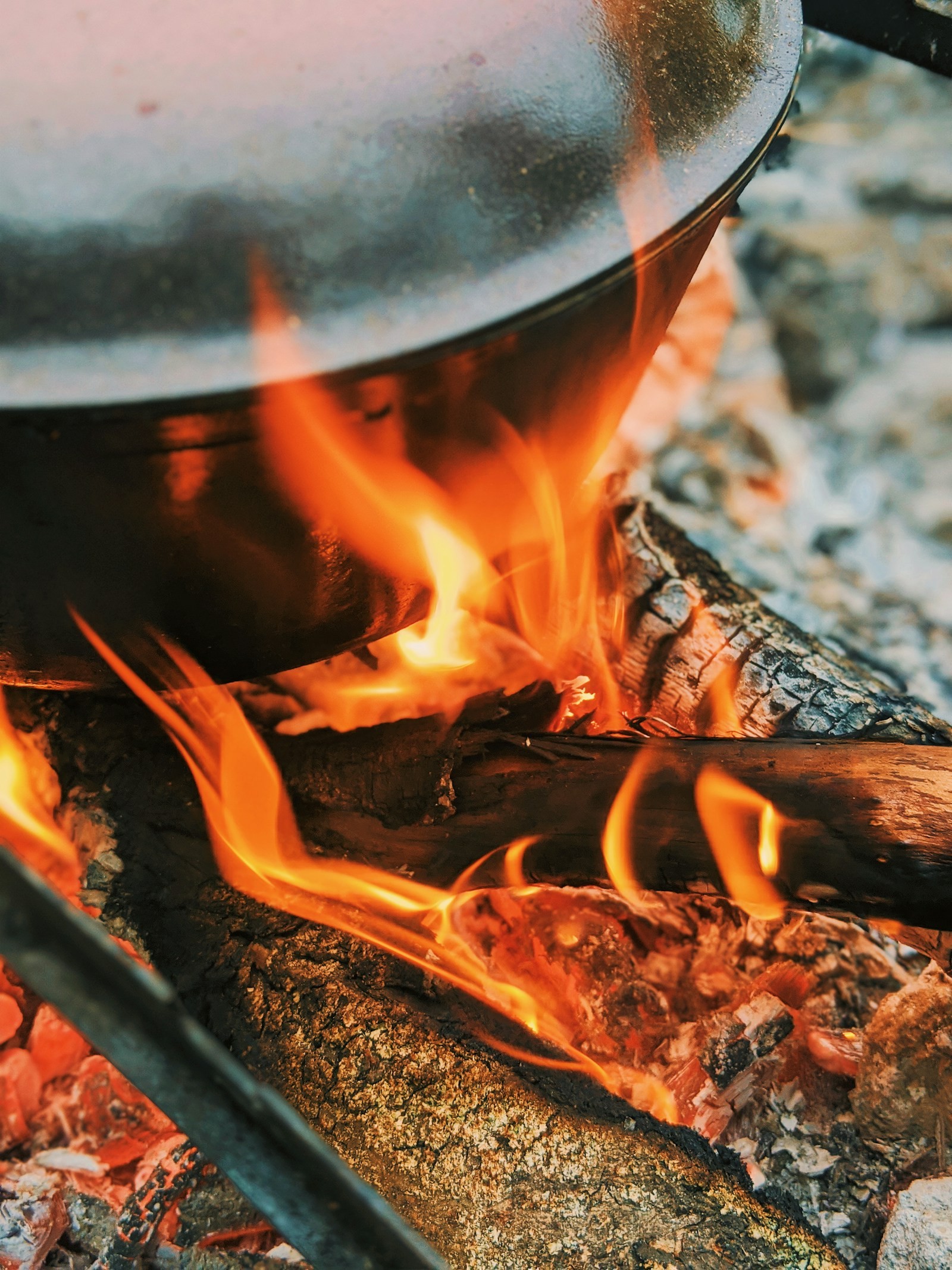 Wood burning in a stone fire pit.