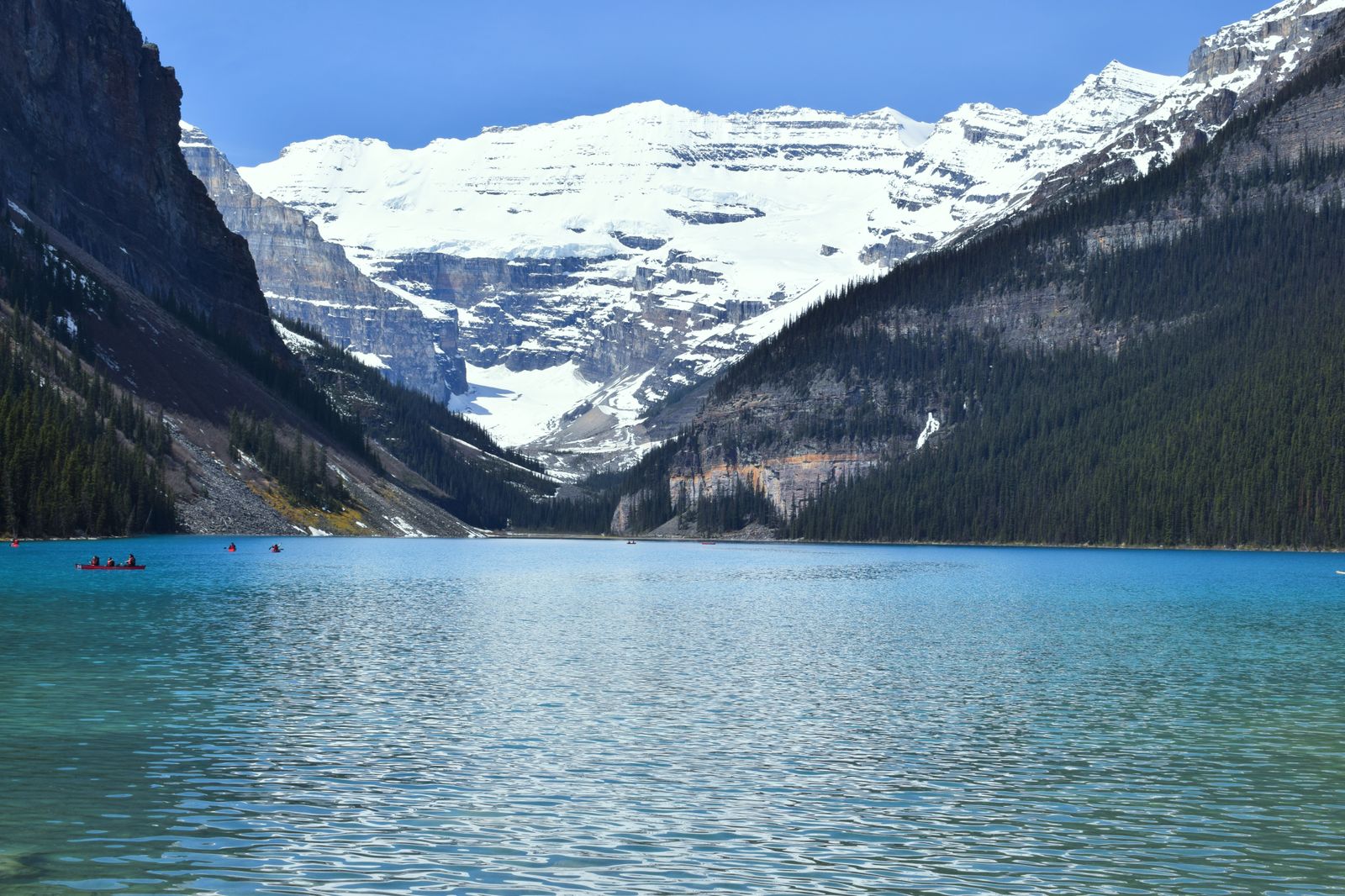 Turquoise water of Lake Louise reflecting snow-capped peaks