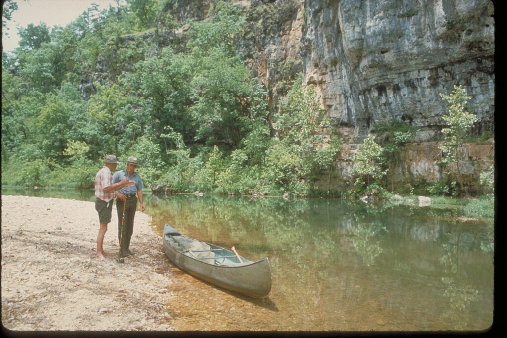 Canoes launching onto a gravel bar on a river in Ozark National Scenic Riverways