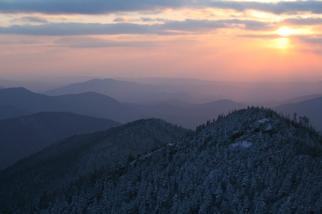 Sunset over snow-dusted mountain ridgelines seen from Cliff Tops on Mount LeConte