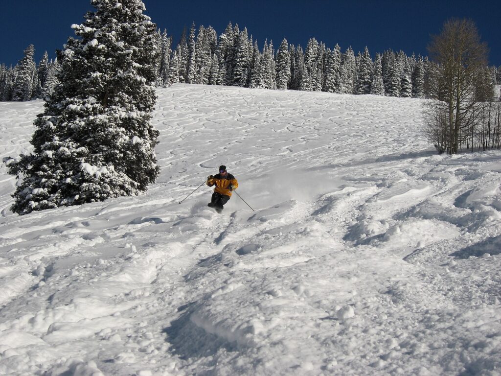 A skier on a snow-covered run at Vail Mountain in Colorado