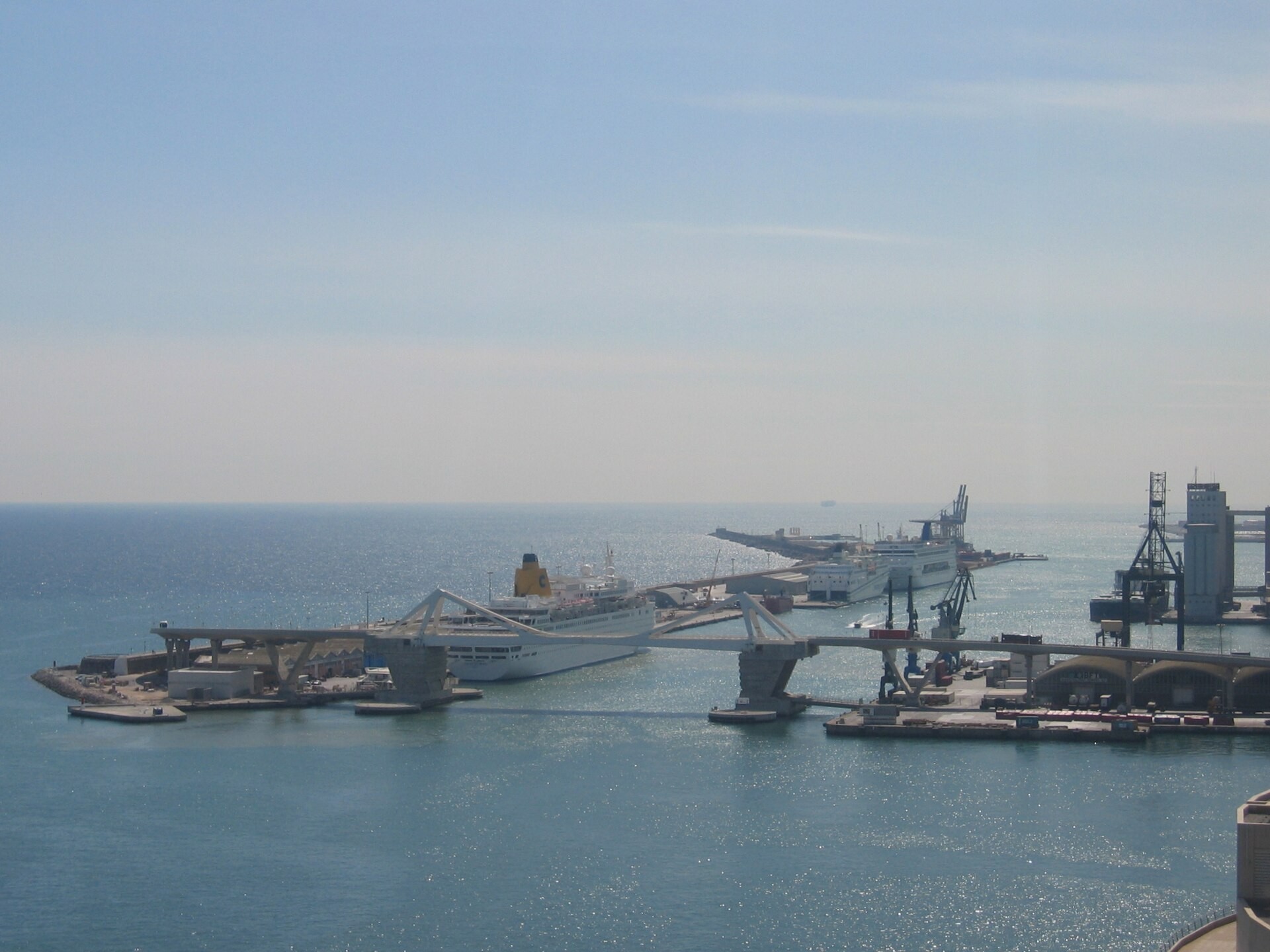 Cruise ships docked at a port, seen from above