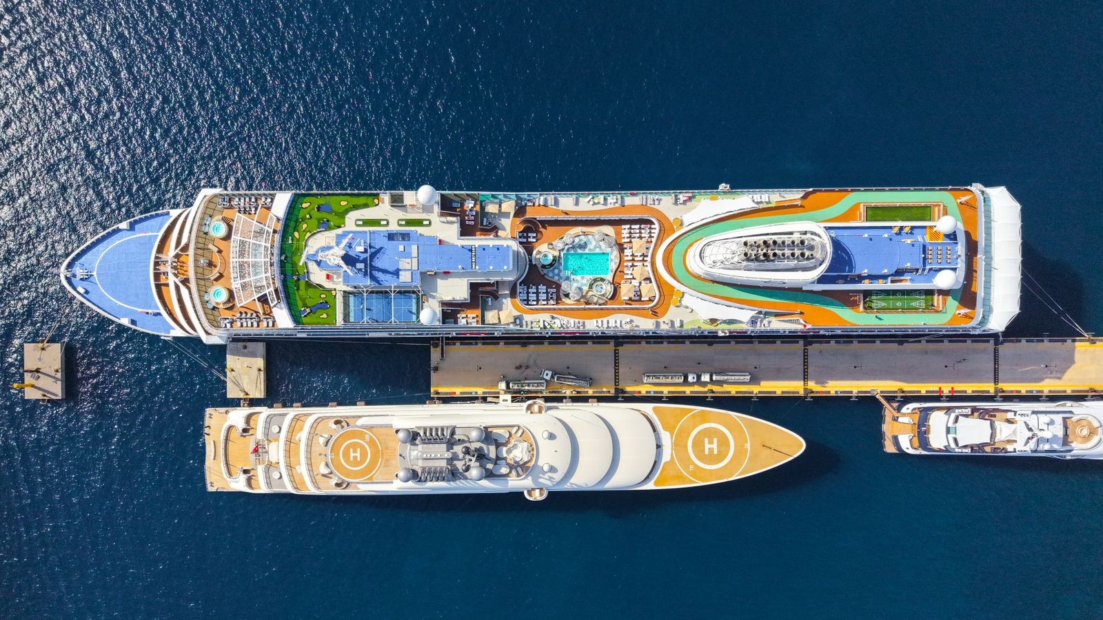 Aerial view of cruise ships moored alongside a dock