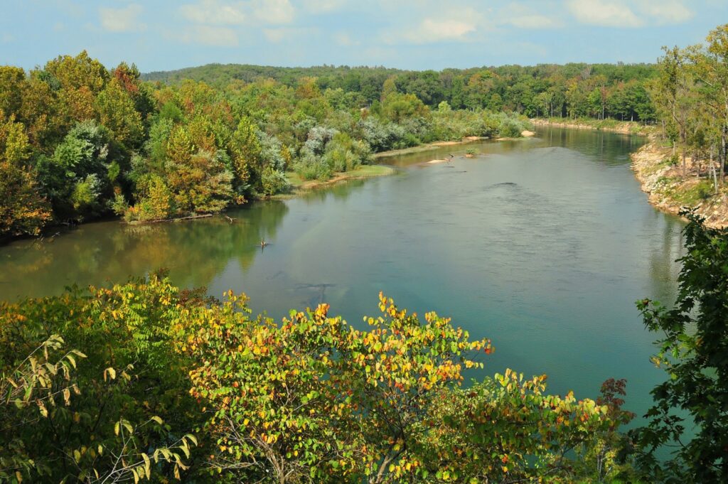 A wide bend of the Current River between wooded Ozark hills in Missouri