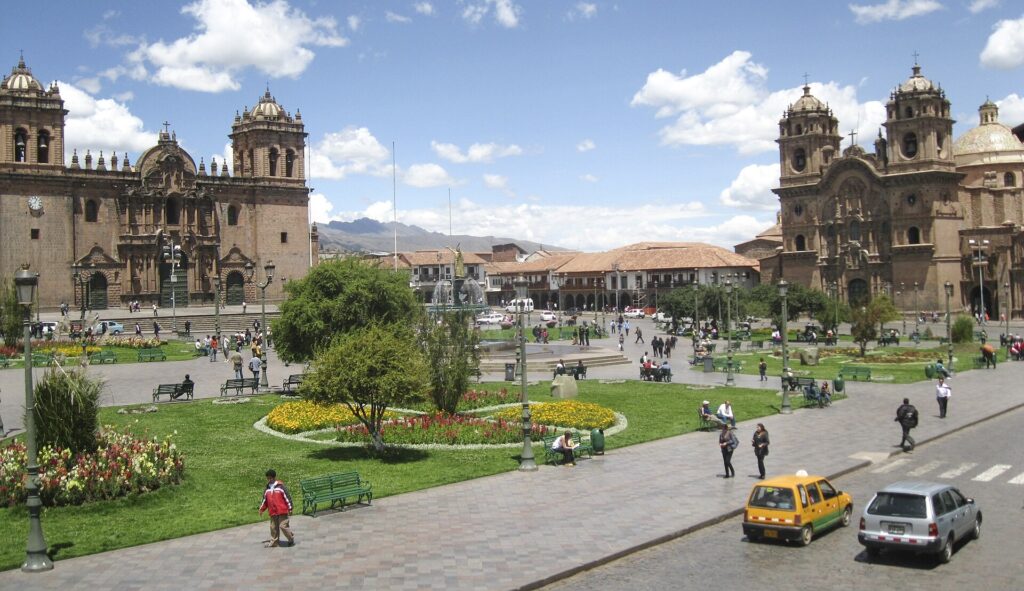 The Plaza de Armas in Cusco with the hills of the city behind it