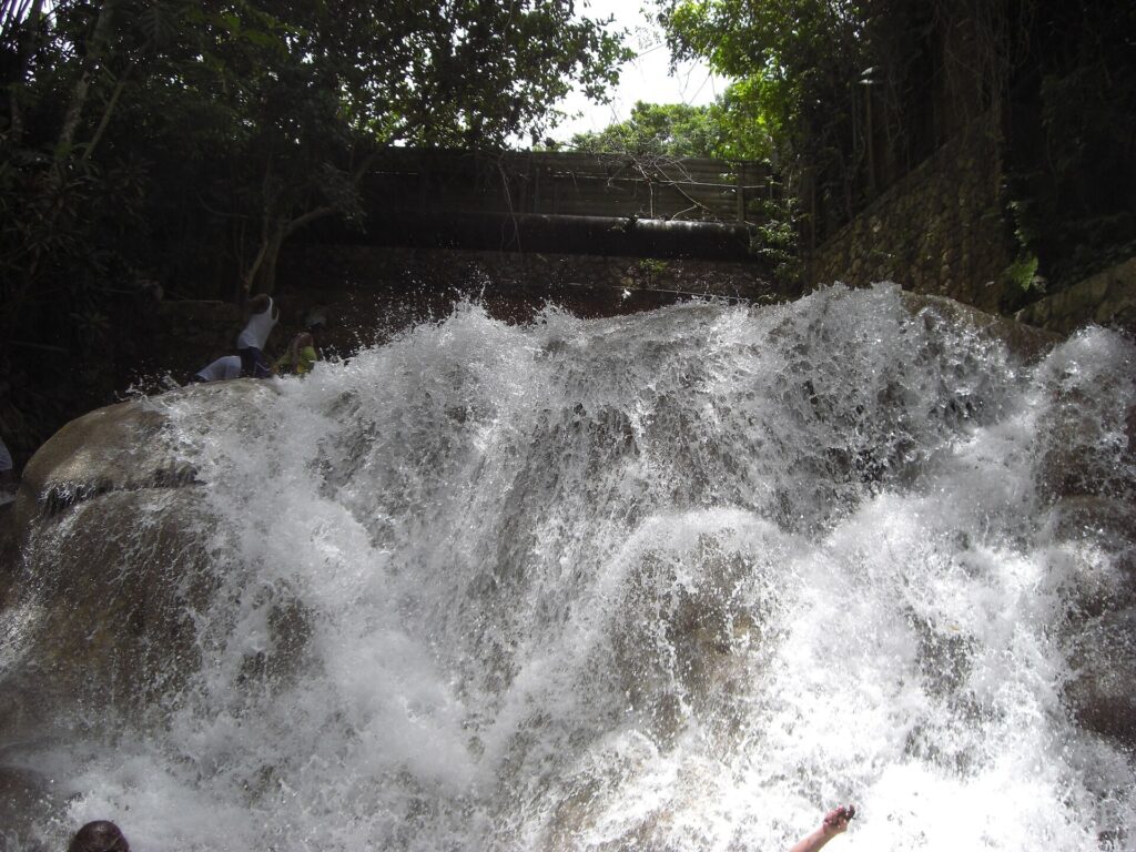 Close-up of water cascading over the limestone terraces of Dunn's River Falls