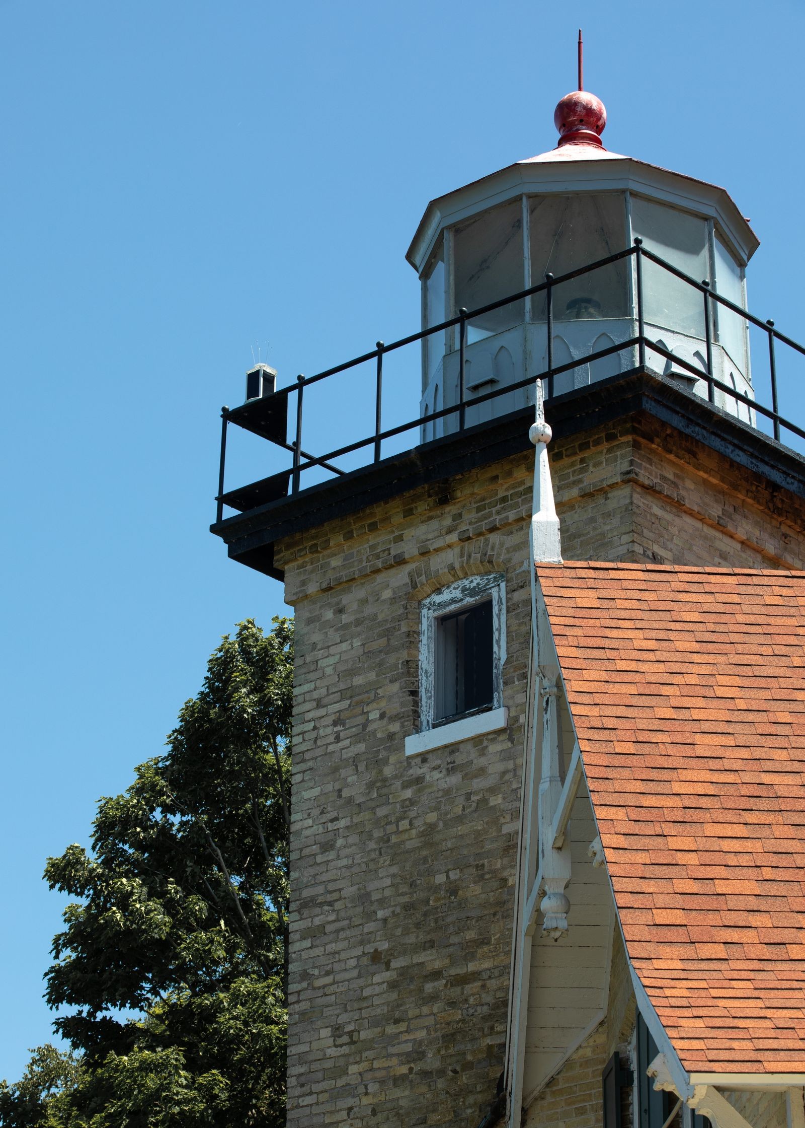 Eagle Bluff Lighthouse under a blue sky at Peninsula State Park