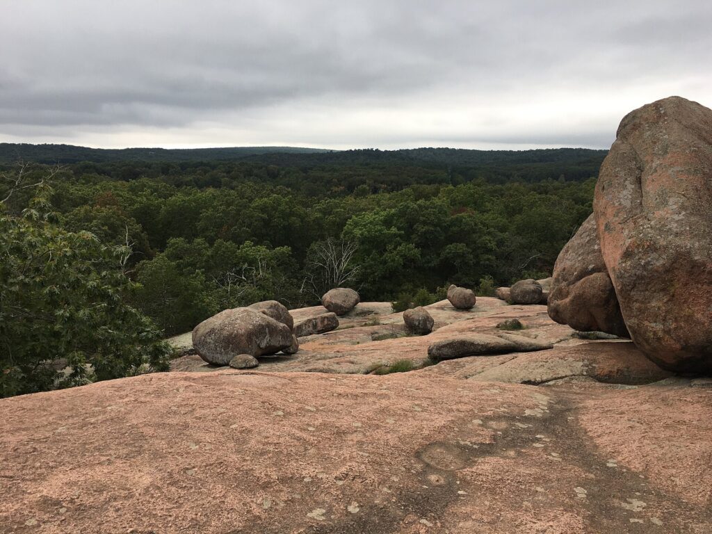 Pink granite boulders scattered across an open hillside at Elephant Rocks State Park, Missouri