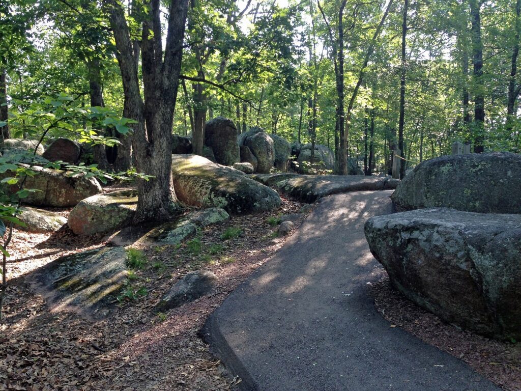 Paved trail winding between large granite boulders at Elephant Rocks State Park