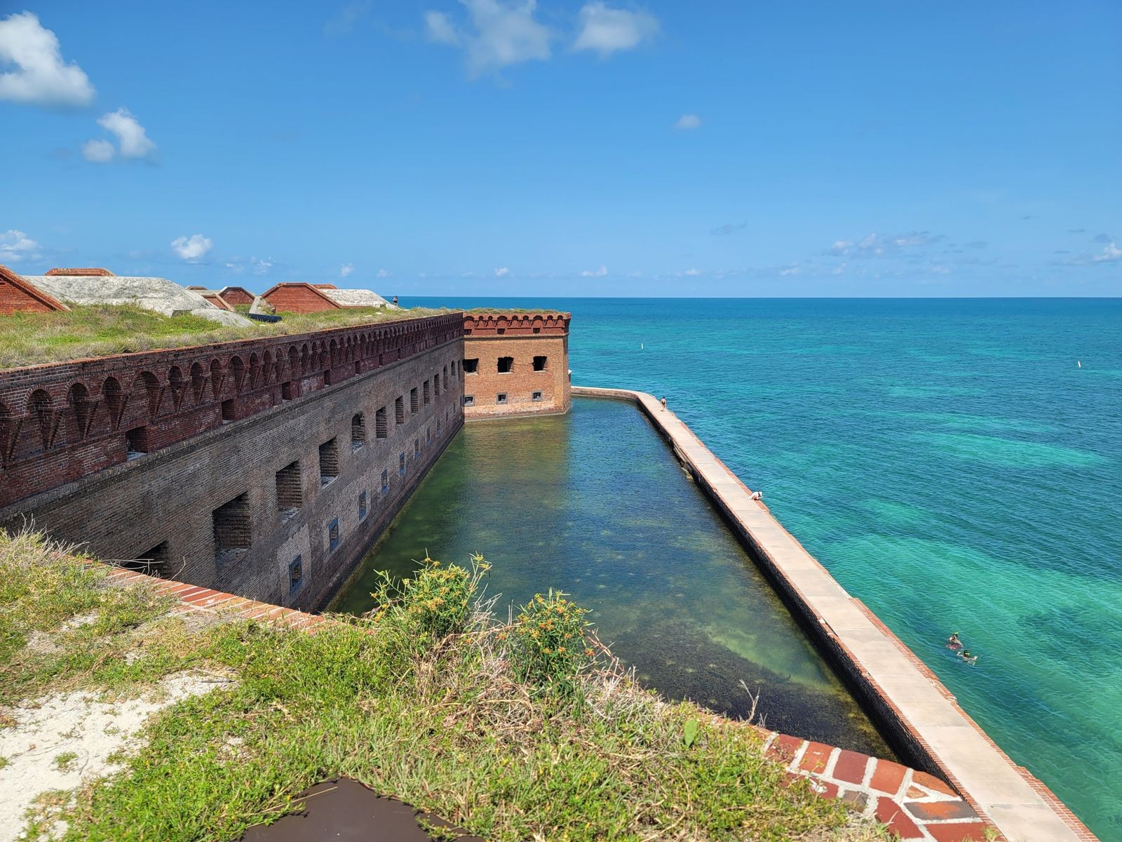 Fort Jefferson's brick wall and moat opening onto turquoise water, Dry Tortugas National Park