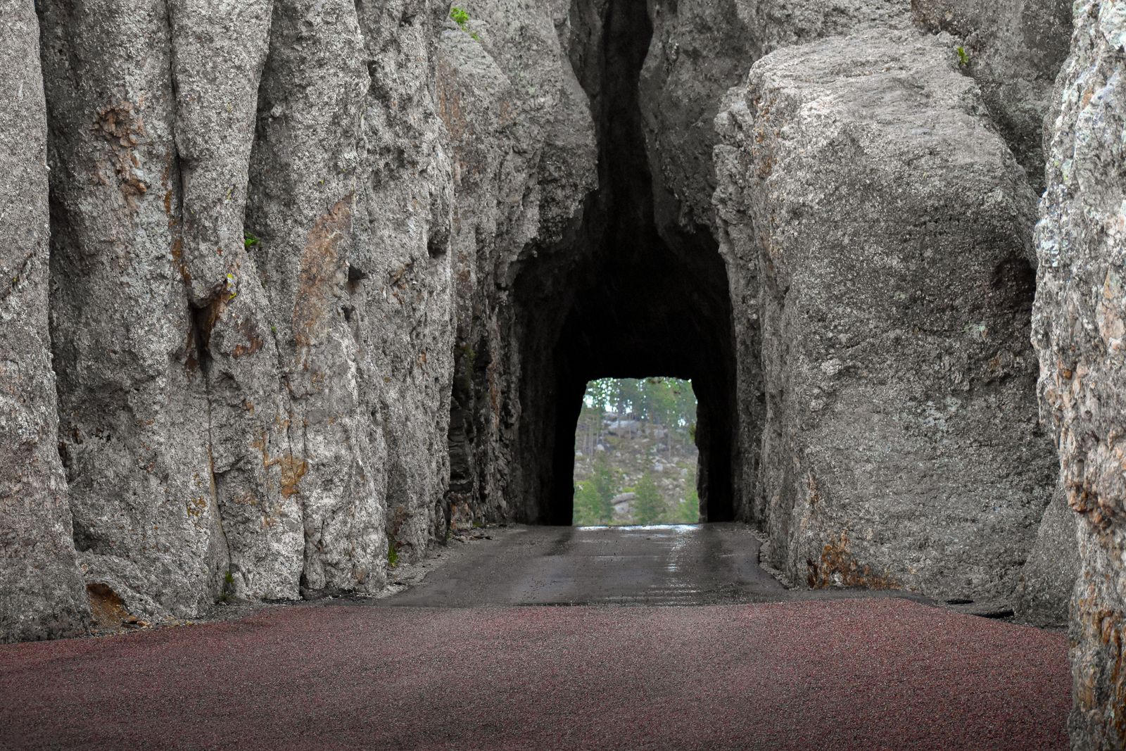 A granite tunnel carved into rock along Needles Highway in the Black Hills