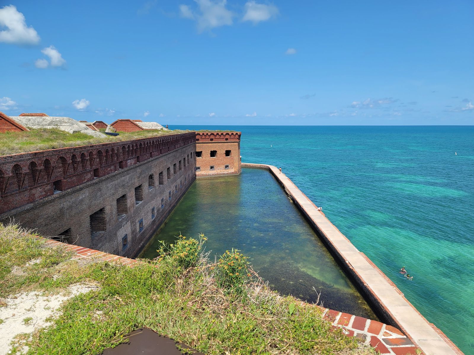 Historic Fort Jefferson at Dry Tortugas National Park surrounded by turquoise water on a clear day