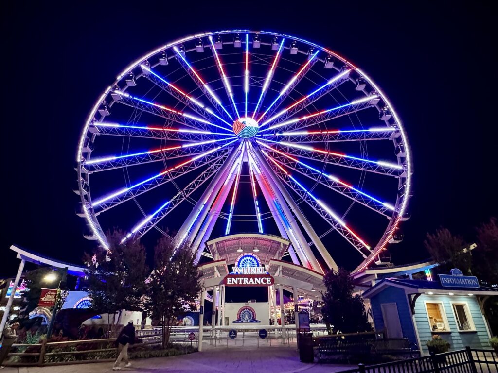 The Great Smoky Mountain Wheel lit up at night at The Island in Pigeon Forge