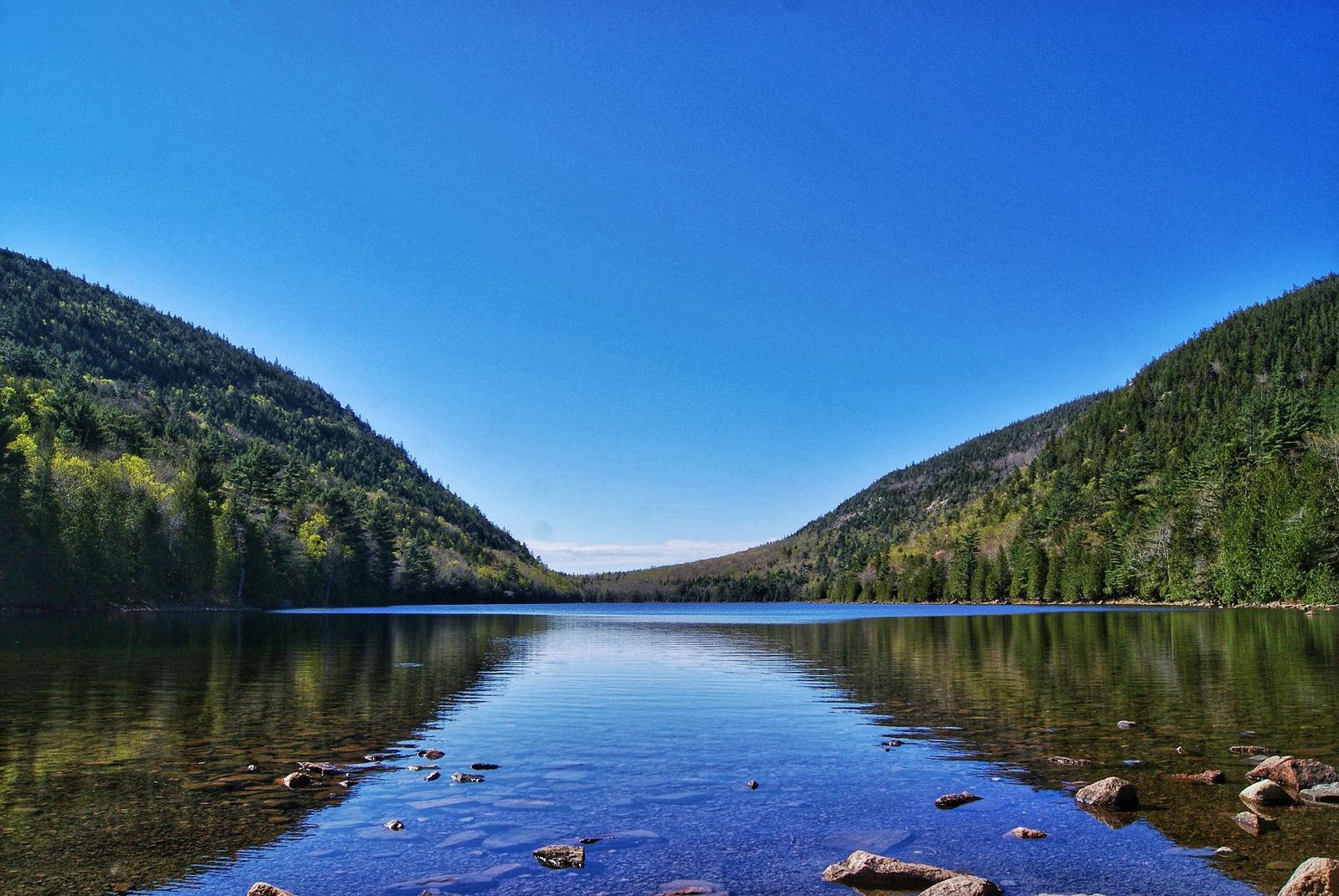 Jordan Pond reflecting the surrounding hills, Acadia National Park