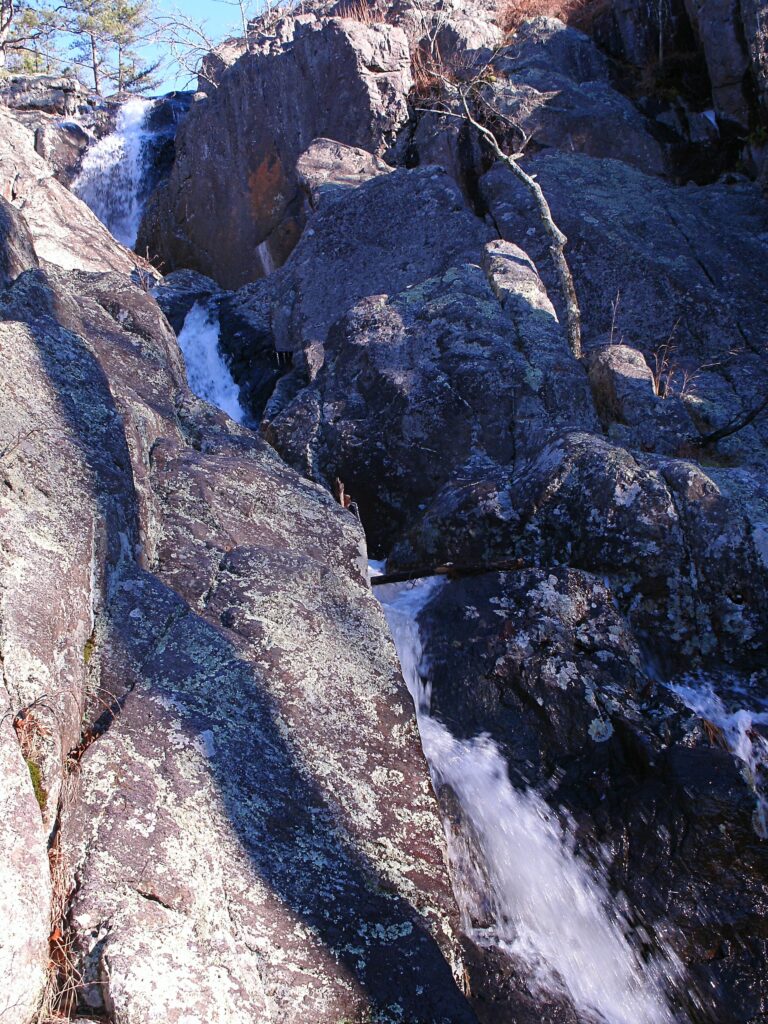 Water flowing over rhyolite rock at Mina Sauk Falls near Taum Sauk Mountain, Missouri