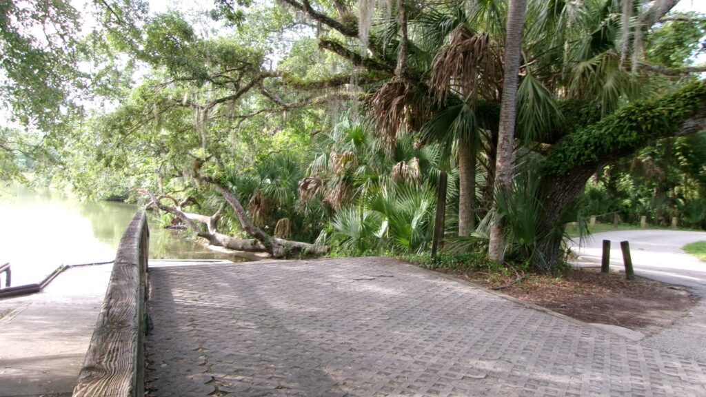 Paved path leading down to the boat ramp on Juniper Creek near the canoe takeout