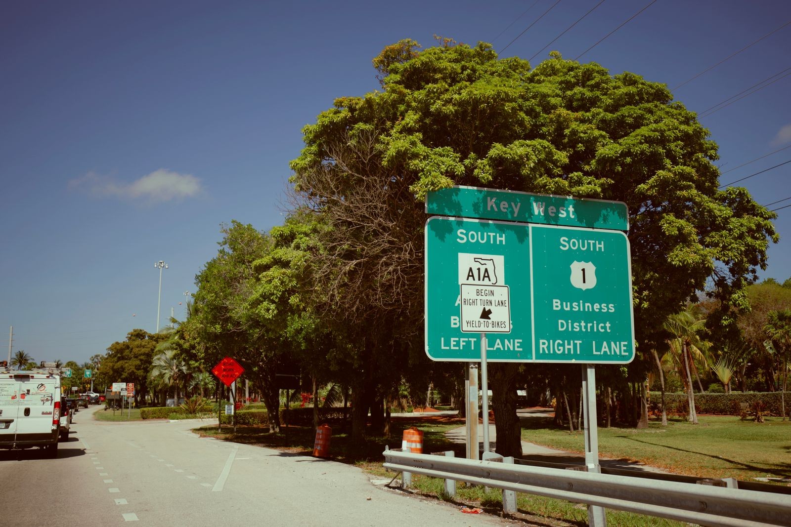 Green highway sign for Key West showing A1A South and US-1 South business district lane assignments