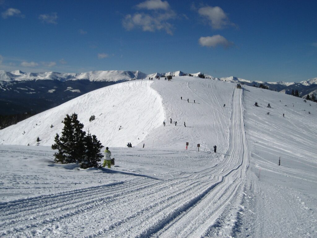 A groomed run cutting across open bowl terrain on The Outback at Keystone Resort