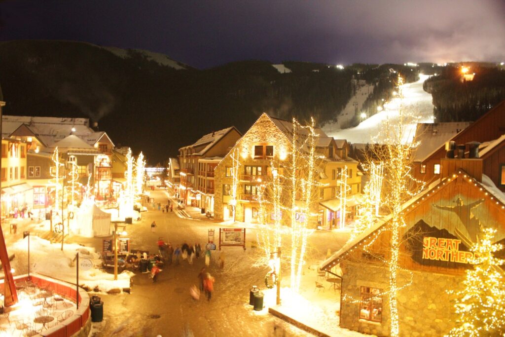 Keystone Village at Keystone Resort, Colorado, lit up at night with snow on the ground