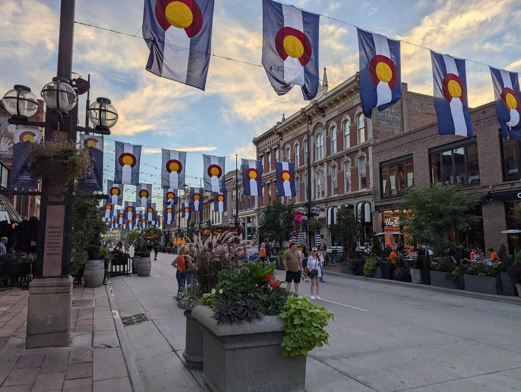 Larimer Square in Denver with string lights over the street and historic brick buildings