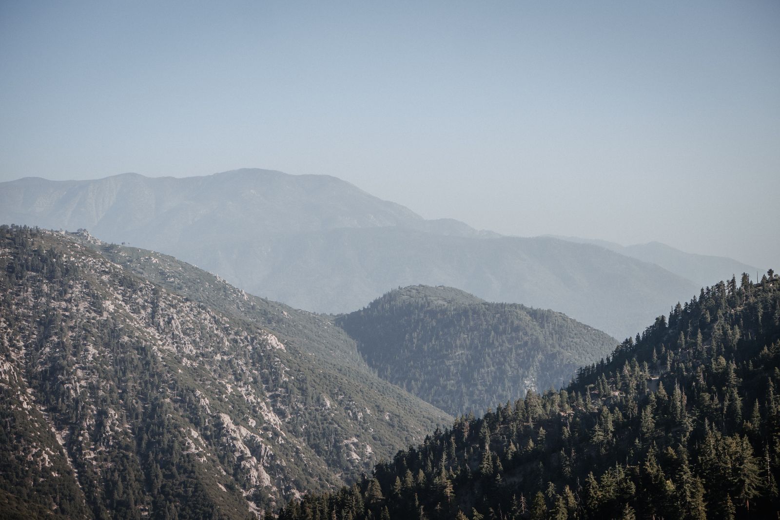 Layered green mountain ridges covered in forest near Big Bear, California