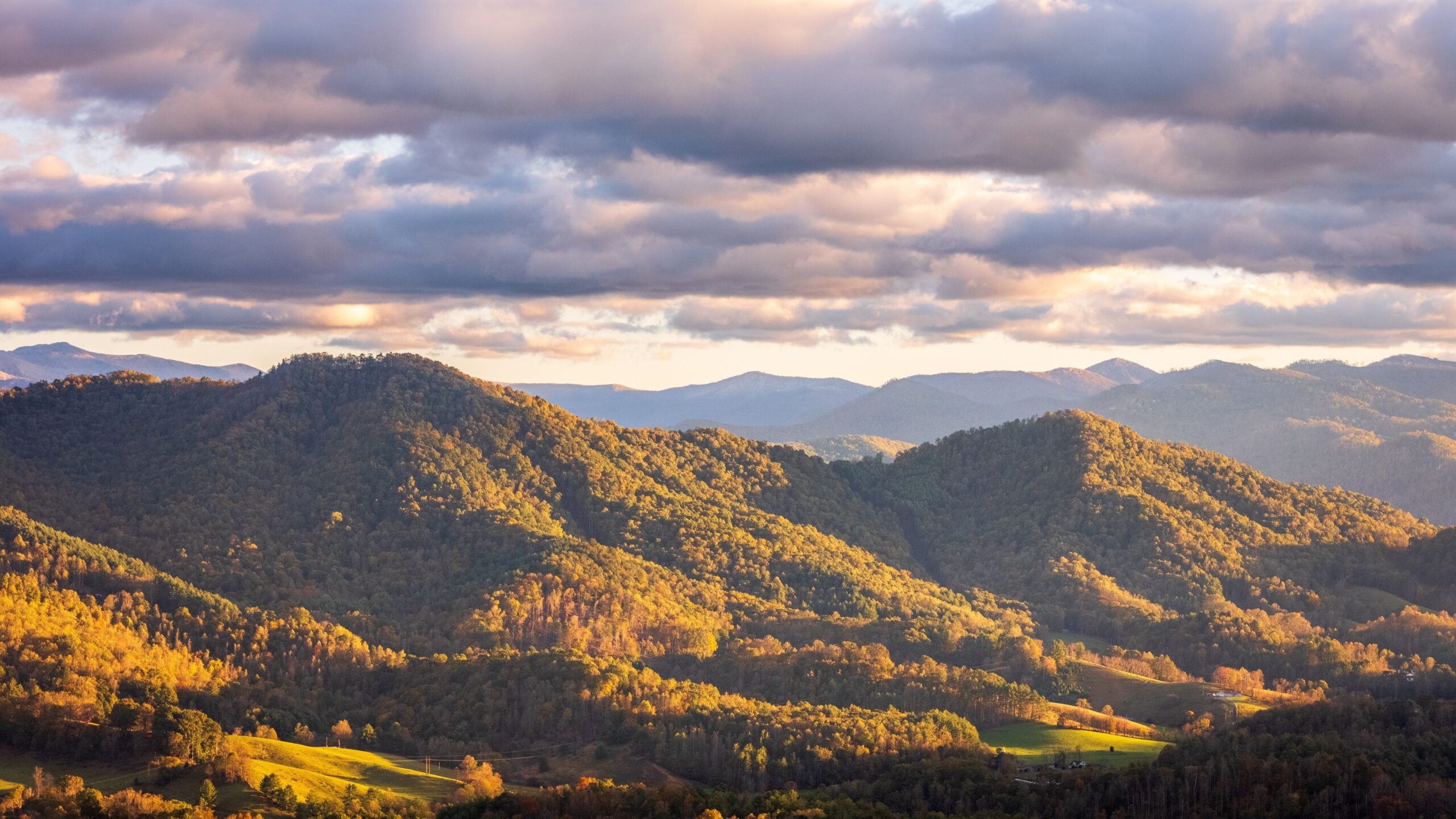 Layered ridgelines of the Great Smoky Mountains glow at sunset