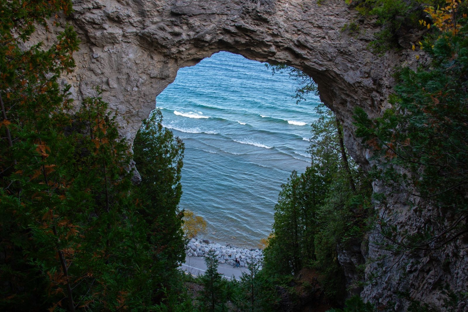 Arch Rock on Mackinac Island framing Lake Huron and the shoreline below