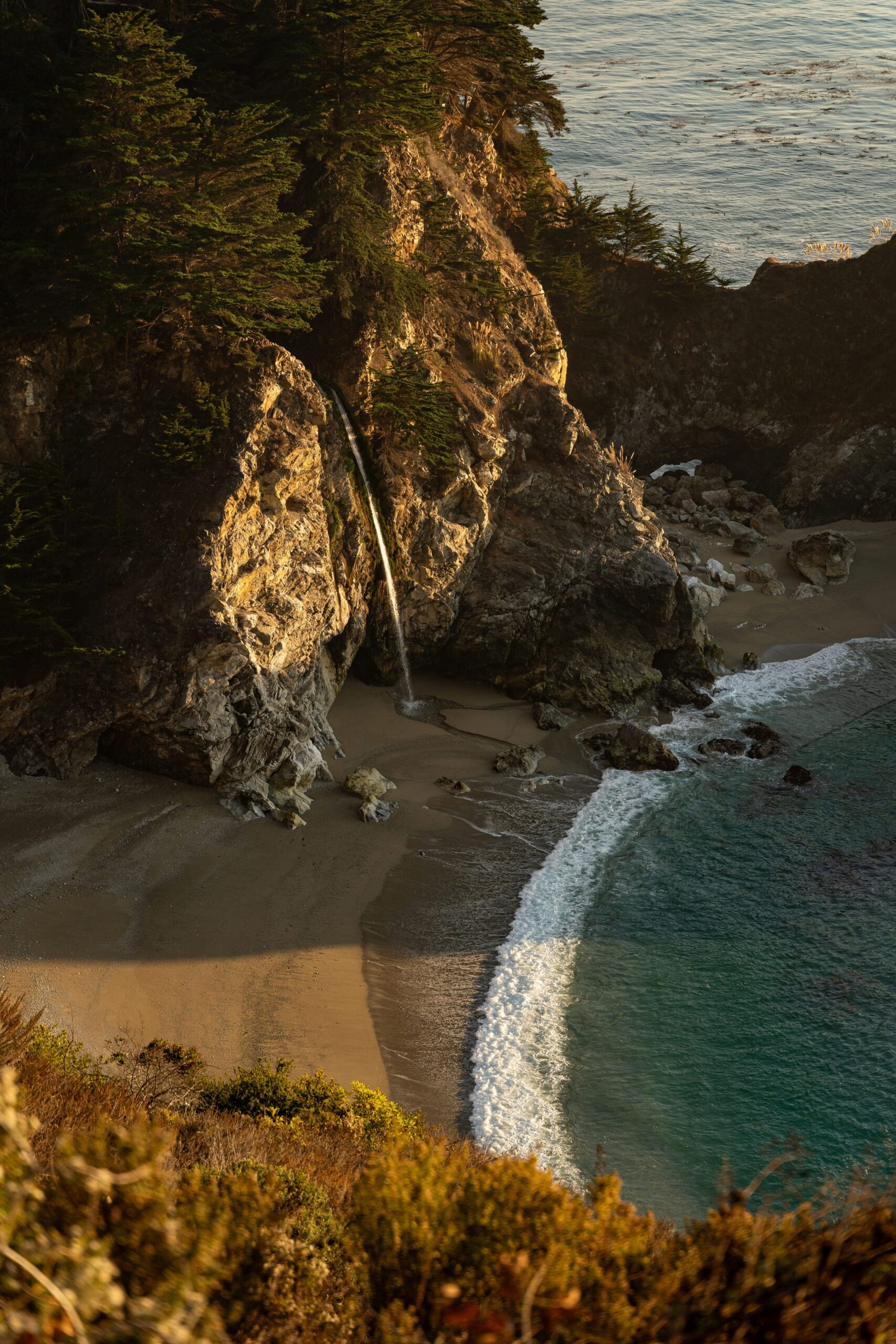 McWay Falls cascading onto the beach at Julia Pfeiffer Burns State Park along the Big Sur coast