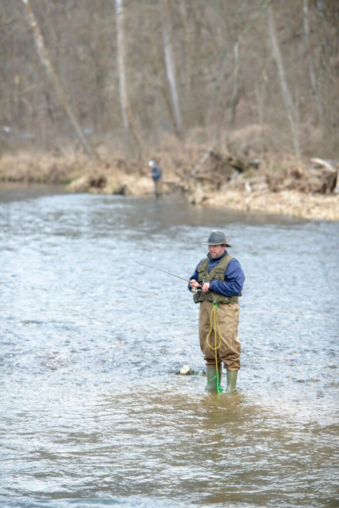 An angler fly fishing in the Current River at Montauk State Park