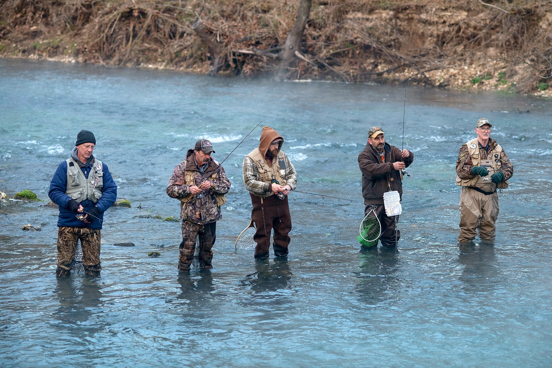 Anglers wading the Current River at Montauk State Park on a misty morning