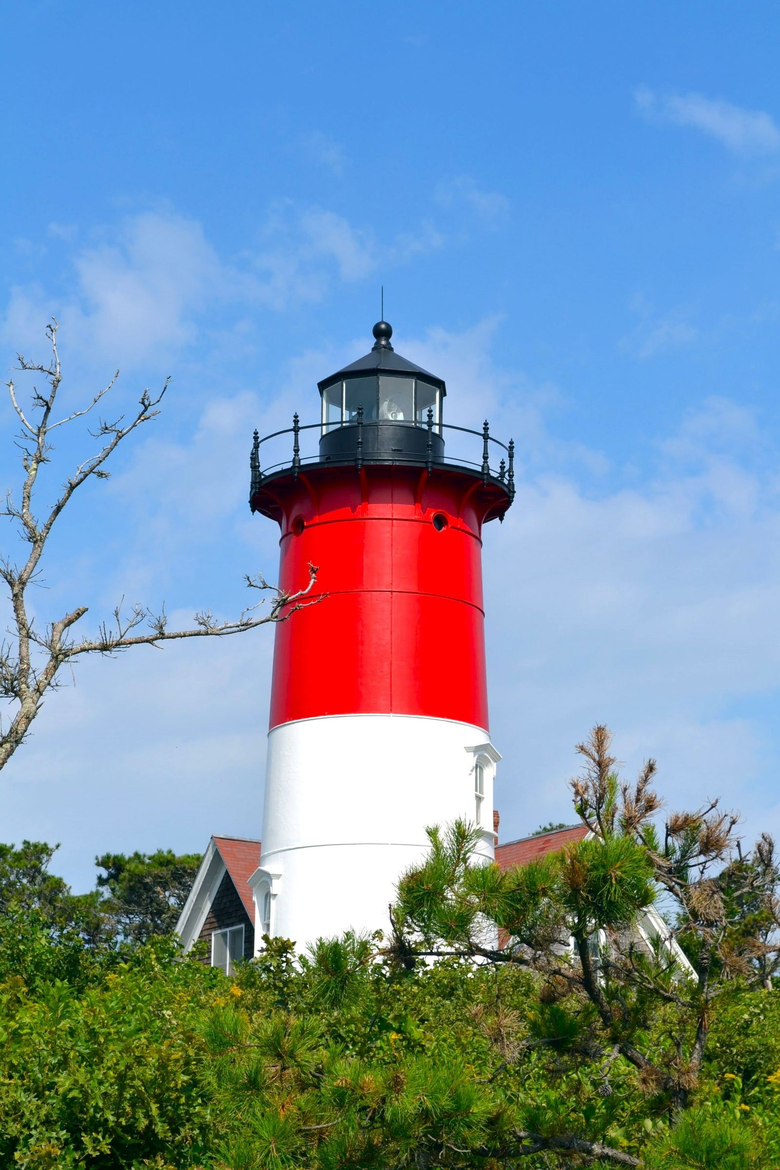 Nauset Light, a red and white lighthouse, in Eastham, Massachusetts