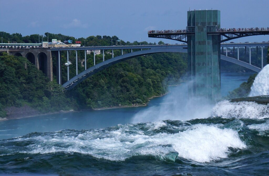 Niagara Falls with the observation tower and bridge on the American side