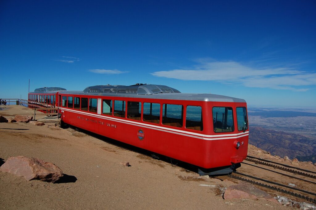 A Pikes Peak Cog Railway train stopped at the summit of Pikes Peak