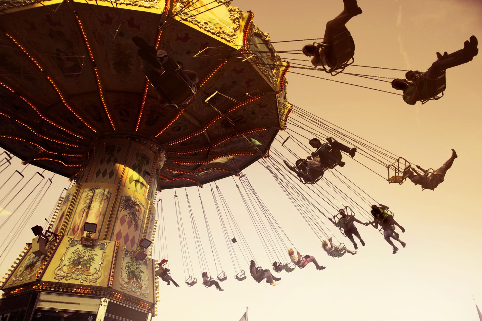 Swing ride at an amusement park at sunset
