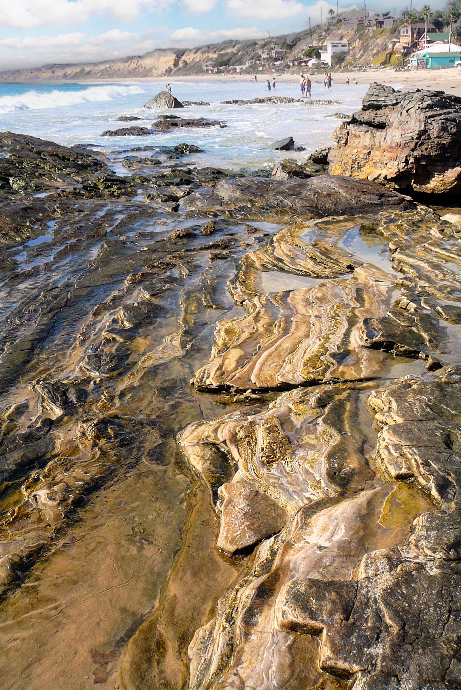 Rugged tide pool rocks exposed along the Laguna Beach coastline