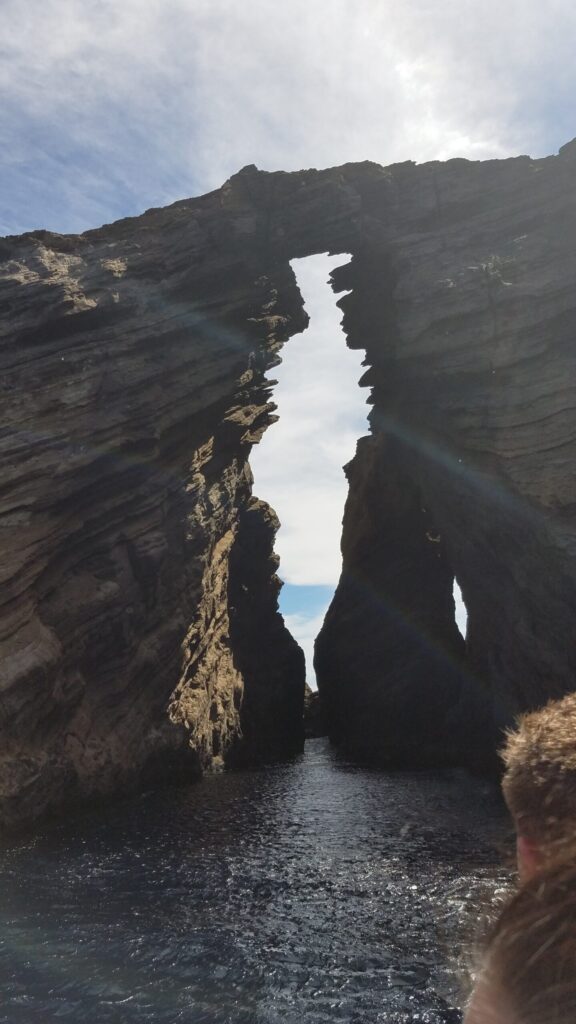 Sea arch on the Na Pali Coast seen from a boat