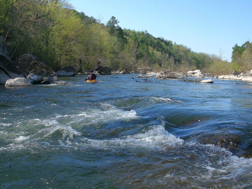 A river runs through hardwood forest at Silver Mines Recreation Area in the Mark Twain National Forest
