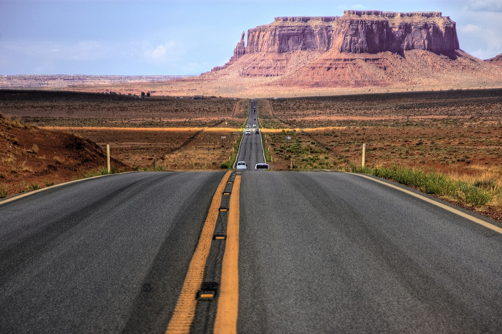 US Route 163 running toward the buttes of Monument Valley