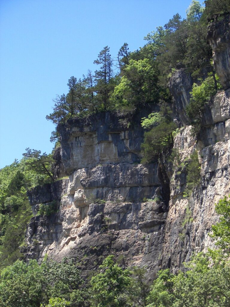Dolomite bluffs and cedar trees above a quiet stretch of the Meramec River