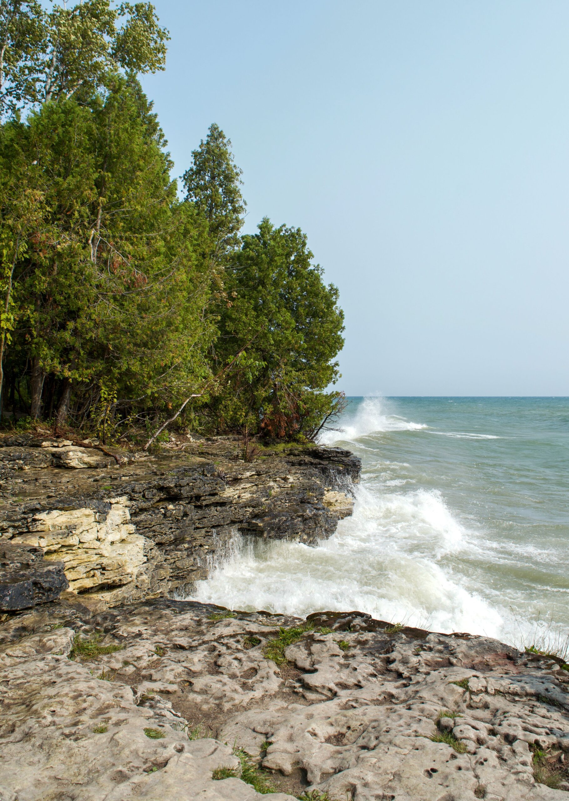Waves washing over a rocky Lake Michigan shoreline near Sturgeon Bay in Door County