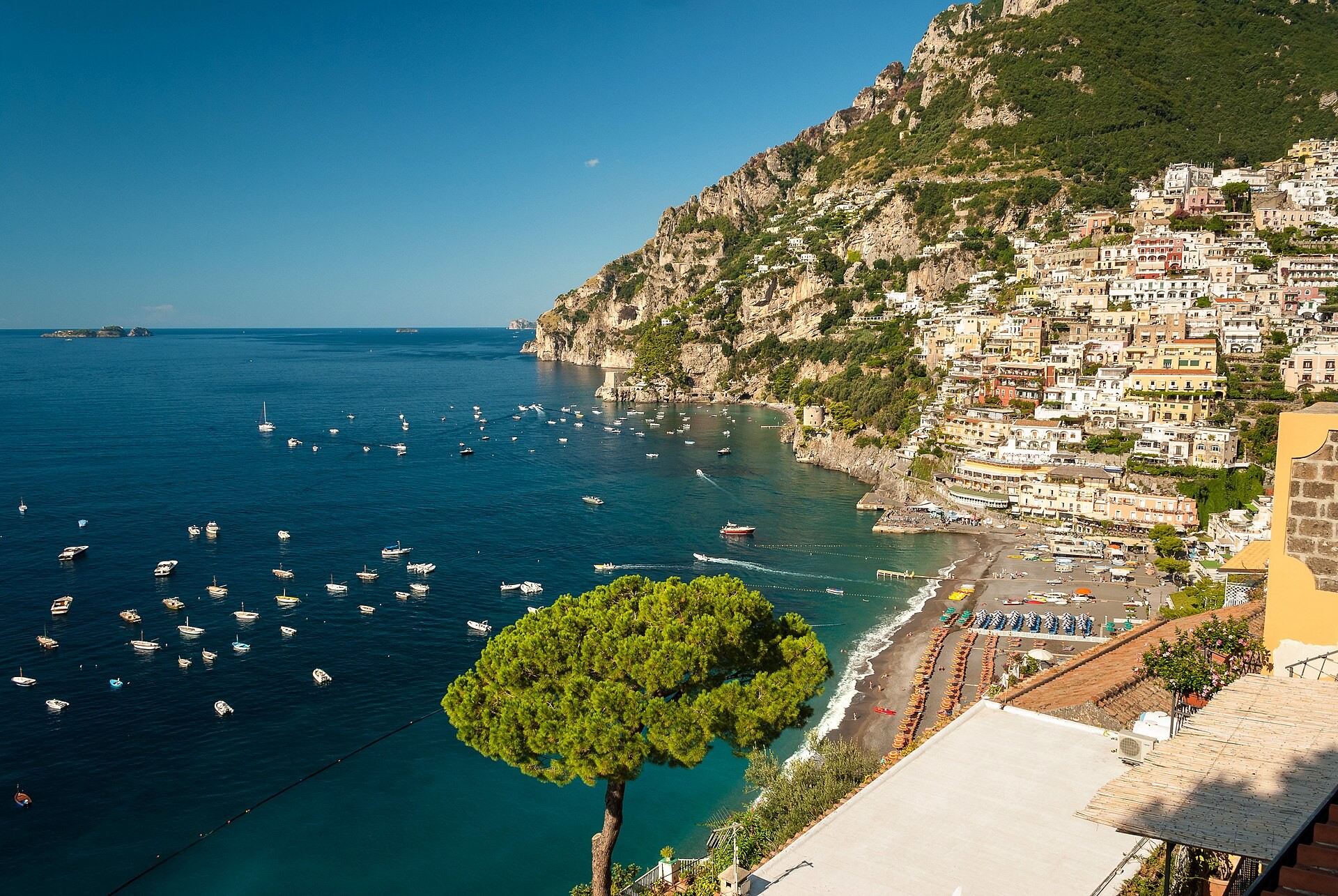 Positano's pastel houses stacked above Spiaggia Grande beach on the Amalfi Coast