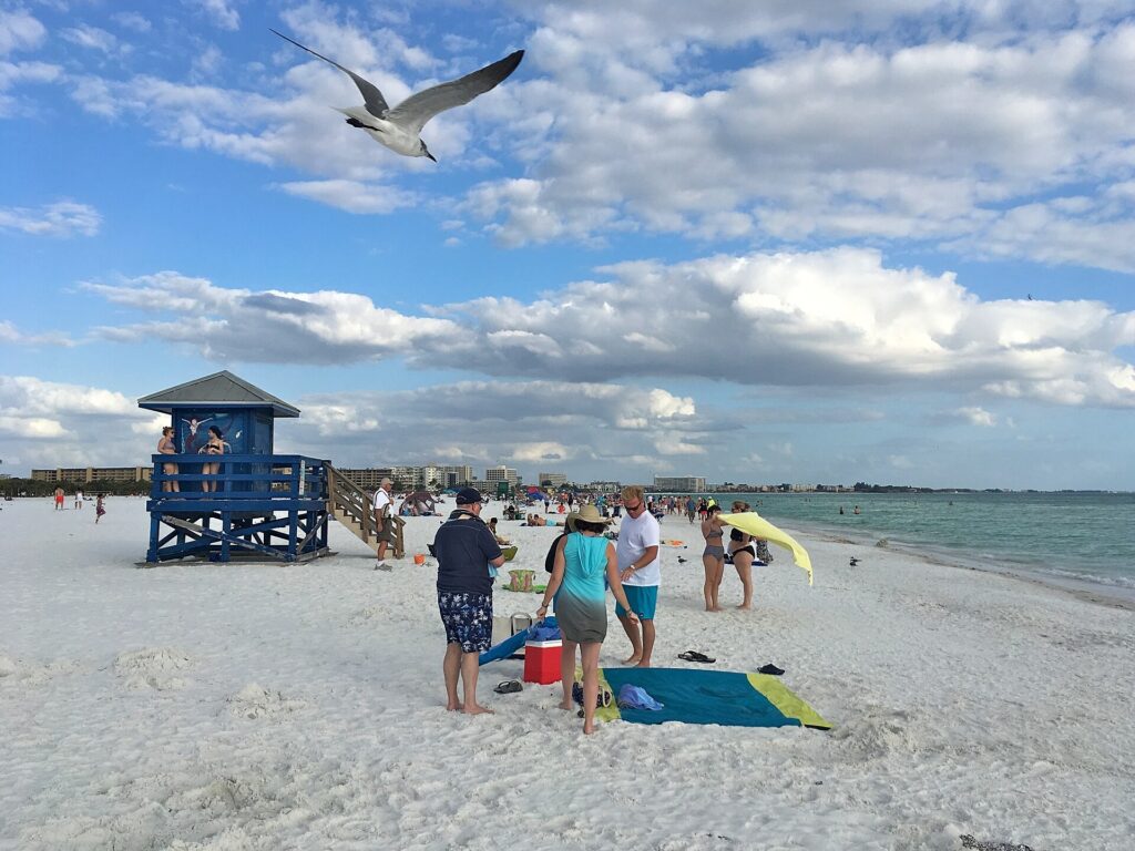 Lifeguard tower and beachgoers on the sand at Coquina Beach, Anna Maria Island